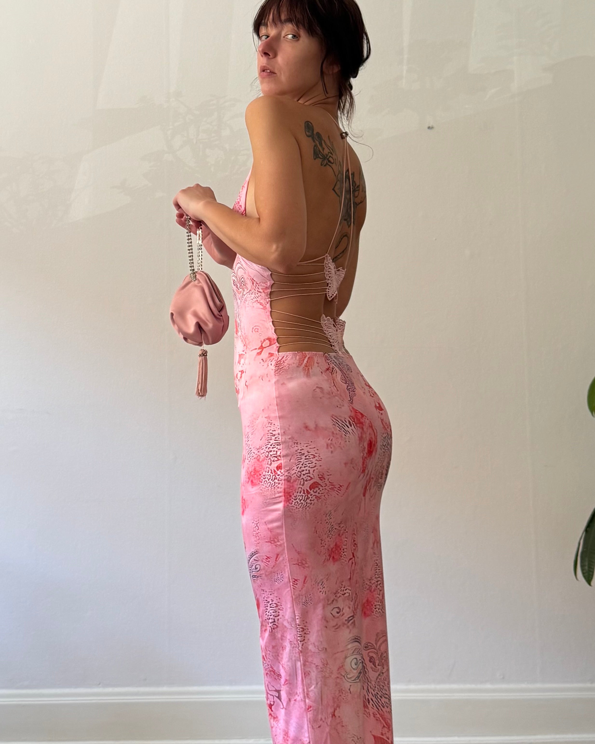 Pink butterfly with a purse