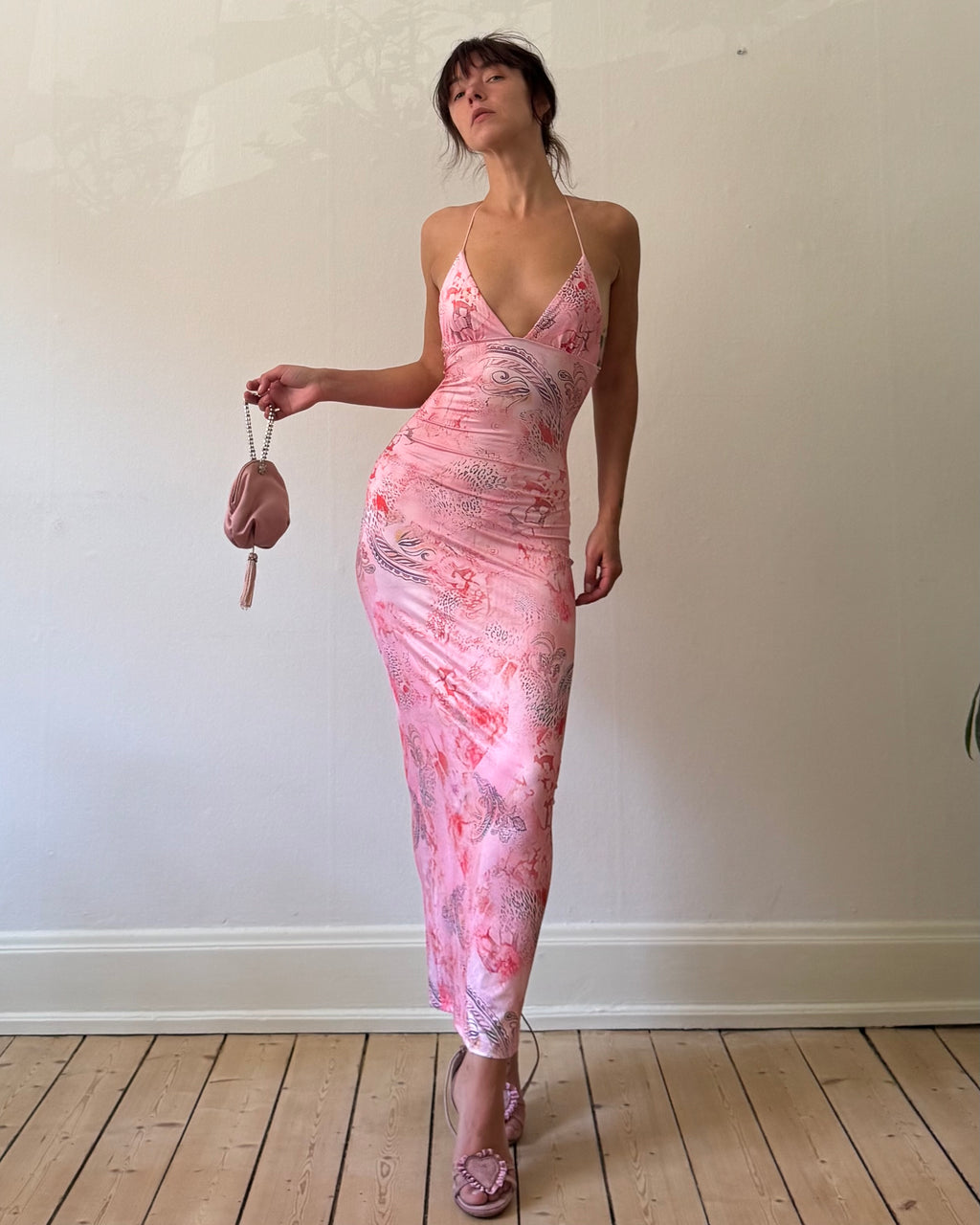 Pink butterfly with a purse