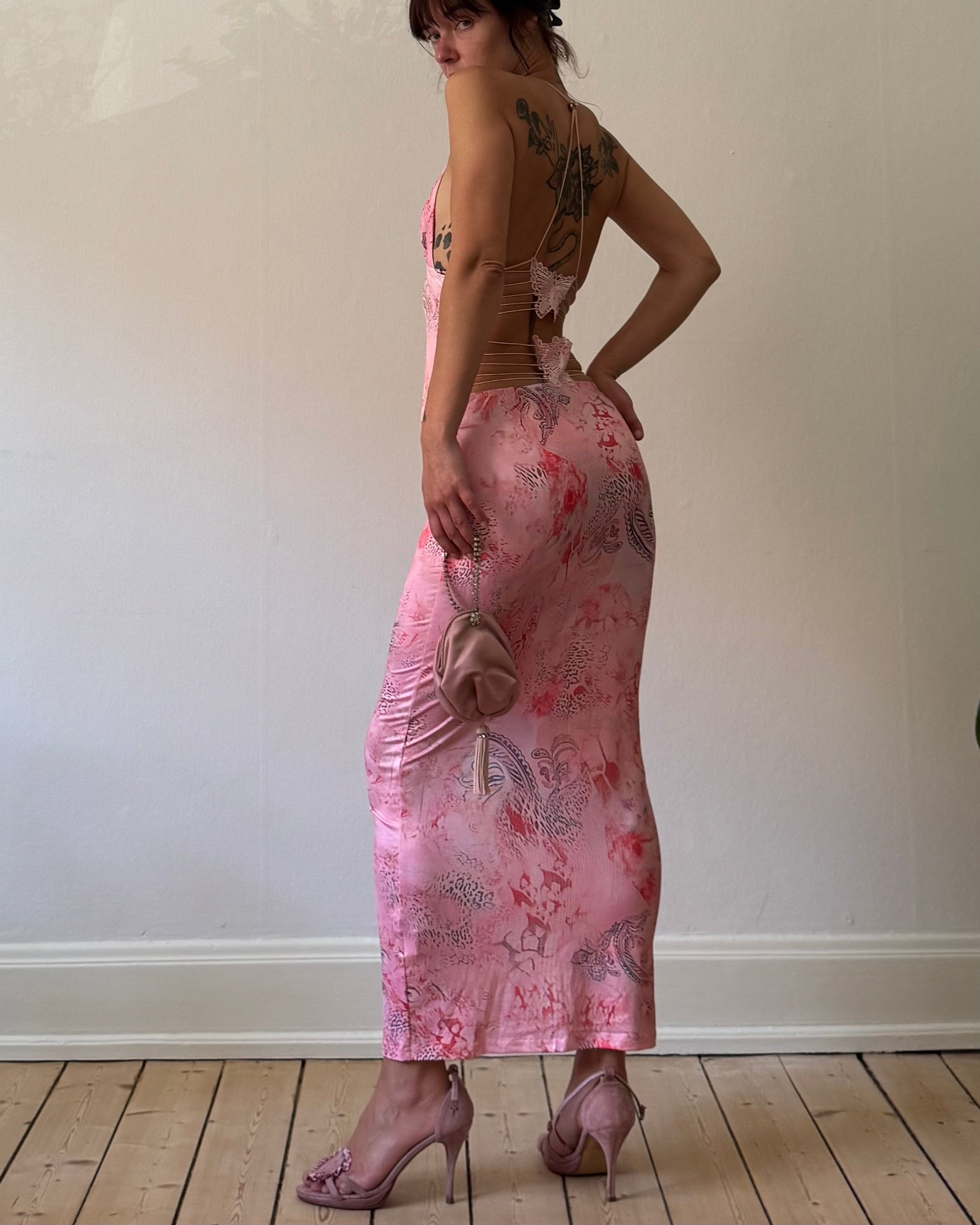 Pink butterfly with a purse