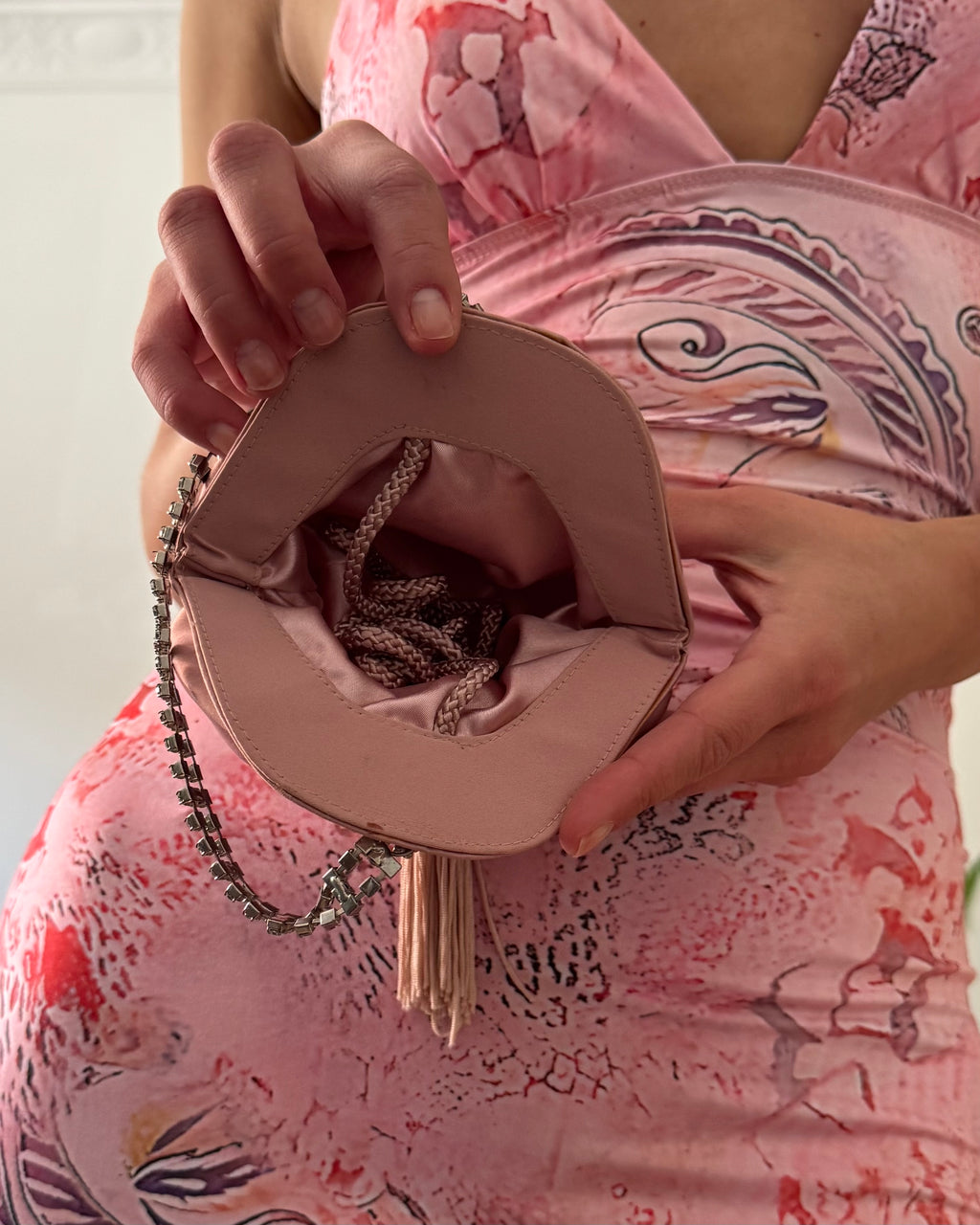 Pink butterfly with a purse